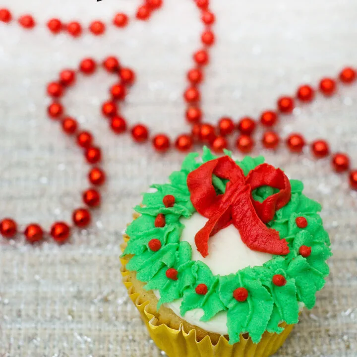 In this Christmas Wreath Cupcake tutorial, I show you how to turn your favorite cupcake into a festive Christmas wreath with some red and green icing and a few simple tools.