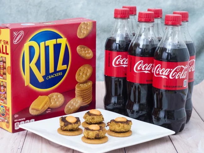 Bring some heat to your bowl game party with mini crab cakes served on RITZ&reg; crackers, topped with spicy sriracha aioli. TheRedheadBaker.com #BowlTimeSnacks #ad