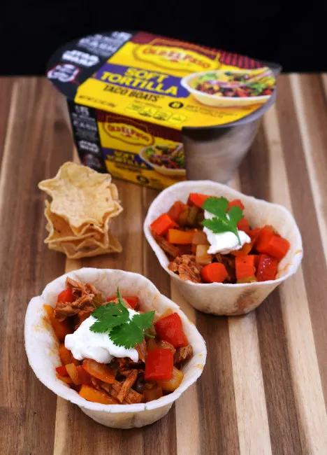 Spice up your Game Day tailgate snacks with these Carnitas Chili Bowls, flavored with Old El Paso&trade; seasoning and salsa, served in soft tortilla bowls. #oldelpaso #acmemarkets