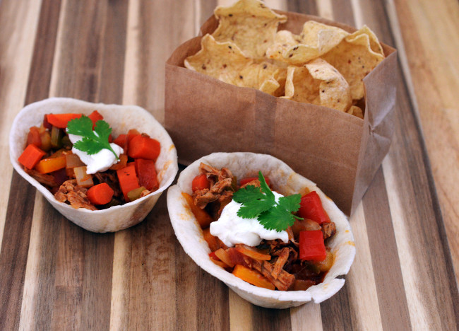 Spice up your Game Day tailgate snacks with these Carnitas Chili Bowls, flavored with Old El Paso™ seasoning and salsa, served in soft tortilla bowls. #oldelpaso #acmemarkets