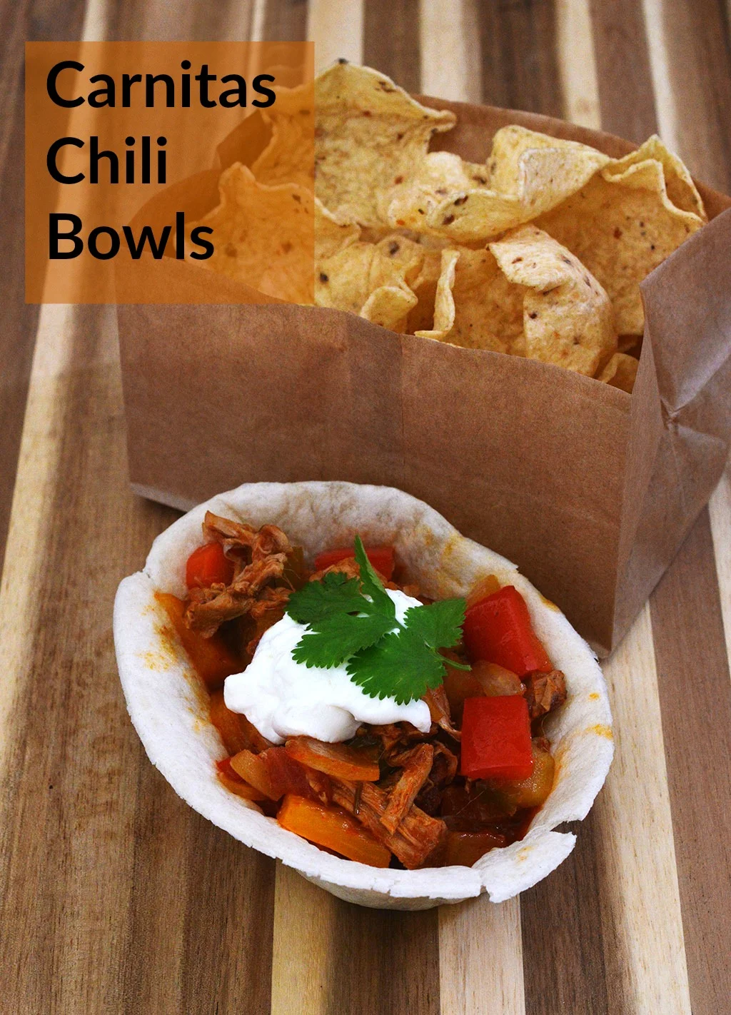 Spice up your Game Day tailgate snacks with these Carnitas Chili Bowls, flavored with Old El Paso™ seasoning and salsa, served in soft tortilla bowls. #oldelpaso #acmemarkets