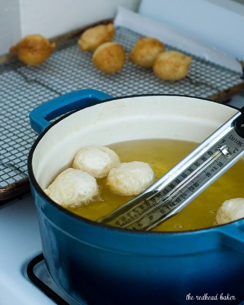 Light, airy puffs of dough are fried, then coated in a sweet honey syrup. Greeks traditionally served them as dessert, but they're equally delicious at breakfast! #SundaySupper TheRedheadBaker.com