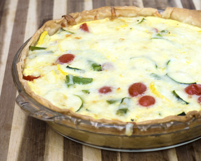 This veggie quiche is loaded with the freshest spring produce. It's a perfect make-ahead meal for breakfast, brunch or dinner! #WhatsBaking