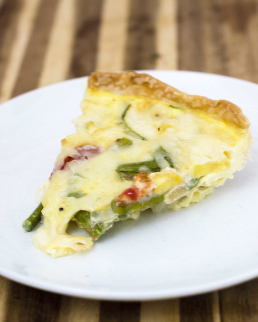 This veggie quiche is loaded with the freshest spring produce. It's a perfect make-ahead meal for breakfast, brunch or dinner! #WhatsBaking TheRedheadBaker.com