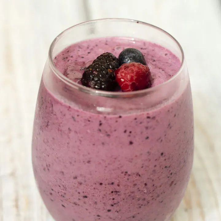 This simple, healthy 3-ingredient berry-vanilla smoothie is the perfect breakfast on-the-go for adults and kids alike. Use your favorite combo of berries! #CLBlogger TheRedheadBaker.com