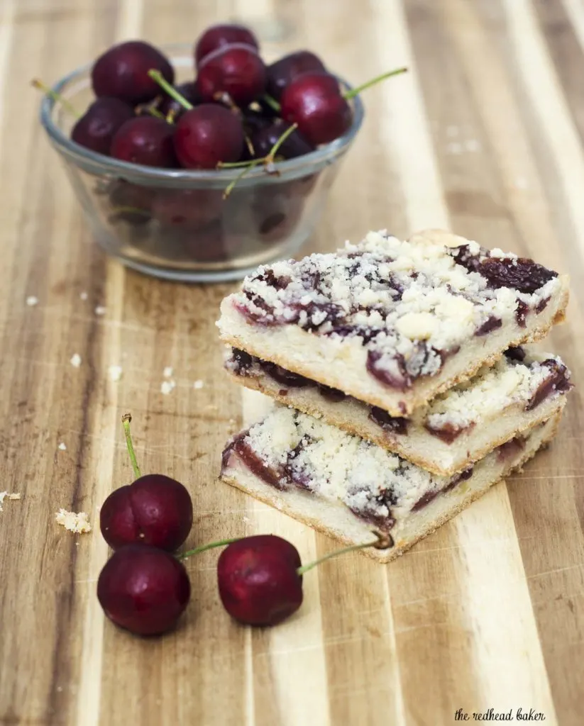 Cherry crumb bars are reminiscent of an American classic, cherry pie, but are less messy, so they're perfect for a potluck or picnic! #SundaySupper TheRedheadBaker