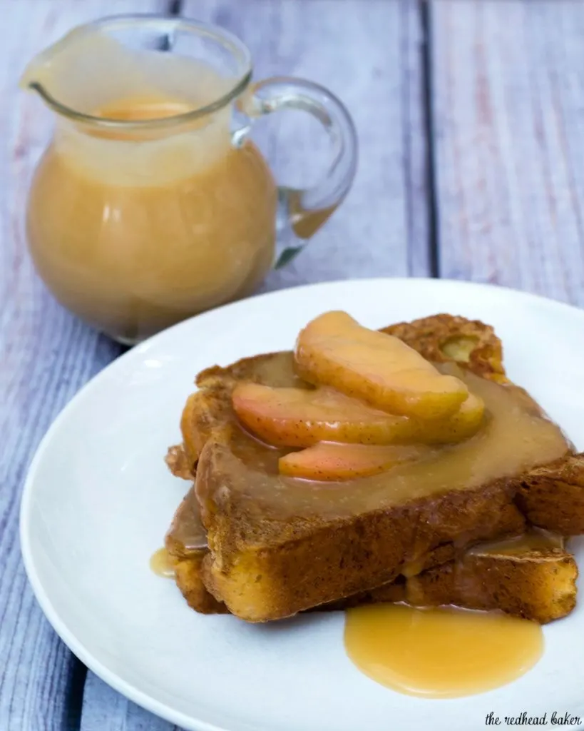 Rich slices of French toast are topped with vanilla-apple compote and caramel syrup. The compote and syrup can be made ahead and rewarmed before serving. #BrunchWeek TheRedheadBaker.com