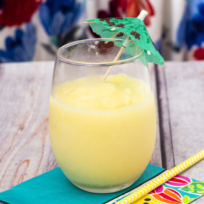 Have a taste of the tropics with a homemade frozen pina colada: a blend of ice, pineapple slices and juice, coconut cream and rum. #SundaySupper TheRedheadBaker.com