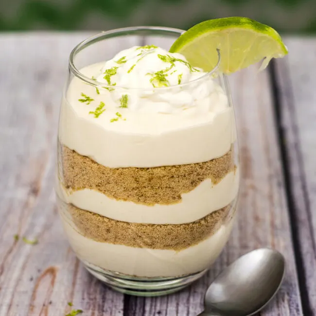 Key lime pie parfaits &mdash; all the flavor of the pie without the work! This no-bake layered dessert is quick and easy to make. #BrunchWeek TheRedheadBaker.com