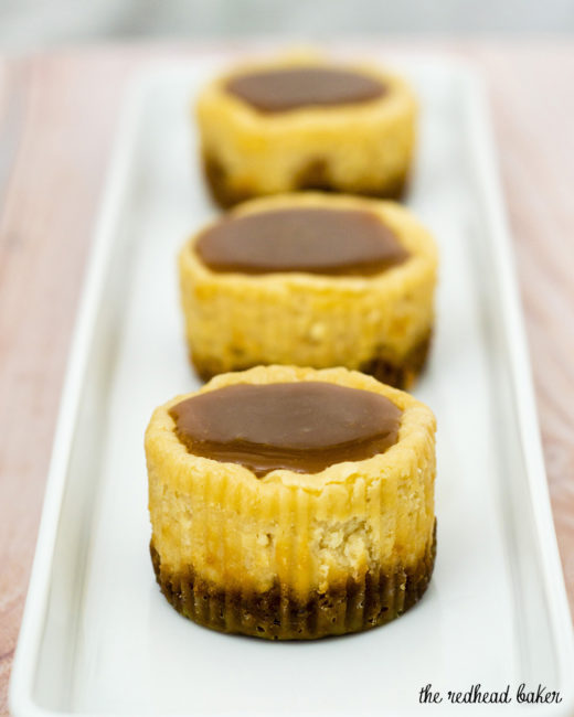 Finish off a tapas-style meal with mini dulce de leche cheesecakes — individual-sized creamy caramel-flavored cheesecakes with a cinnamon-crumb crust. #SundaySupper TheRedheadBaker.com