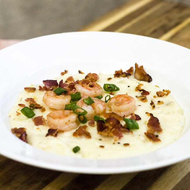 Shrimp and grits are a traditional southern breakfast. Sauteed shrimp are served over grits flavored with sharp Cabot cheddar cheese. #BrunchWeek TheRedheadBaker.com