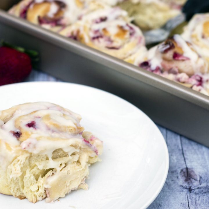 With summer on the way, give your sweet rolls a seasonal twist: fill them with fresh strawberries and sweetened cream cheese, then top with a sweet-tart lemon-flavored simple icing. #BrunchWeek TheRedheadBaker.com