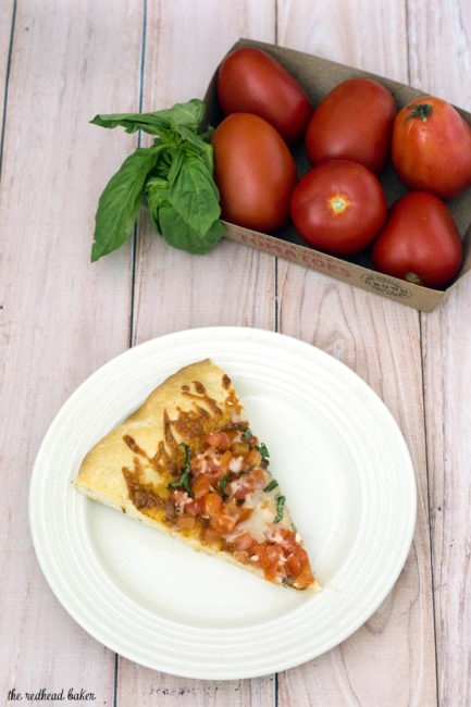 Bruschetta pizza is loaded with fresh summer tomatoes, basil and garlic over lots of melted mozzarella cheese. What better flavor for summer pizza? #ProgressiveEats