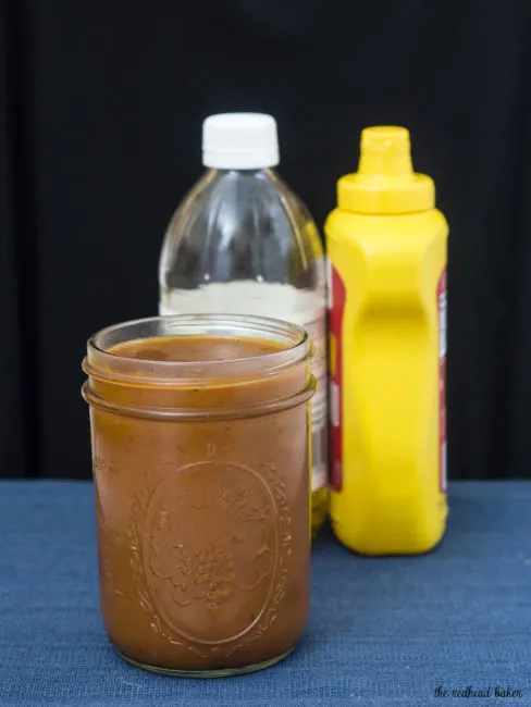 Carolina-style barbecue sauce has a base of mustard and vinegar with just a bit of tomato sauce, unlike other regional barbecue sauces. It's spicy and tangy and delicious on everything! TheRedheadBaker.com