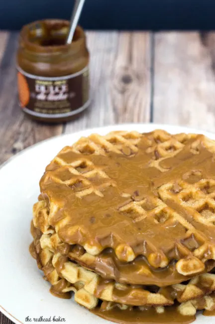 Like the Mexican pastry, churro waffles are coated in cinnamon sugar and drizzled with dulce de leche sauce. Enjoy for breakfast or dessert! #SundaySupper