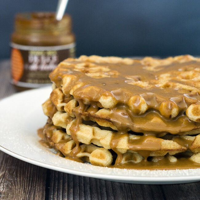 Like the Mexican pastry, churro waffles are coated in cinnamon sugar and drizzled with dulce de leche sauce. Enjoy for breakfast or dessert! #SundaySupper