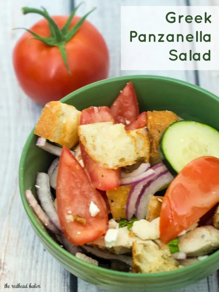 Greek Panzanella Salad is a perfect summer weeknight meal that combines tomato, red onion, cucumber, chicken and toasted bread with a homemade vinaigrette. TheRedheadBaker.com