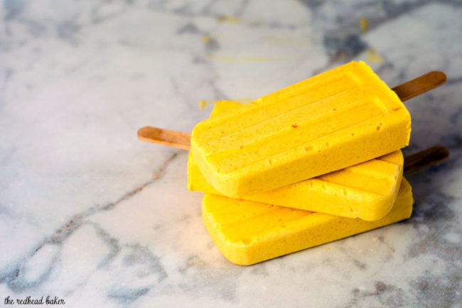 Mango creamsicles have only three ingredients, and are so easy to make! They're my son's favorite treat on a hot summer day. #SundaySupper