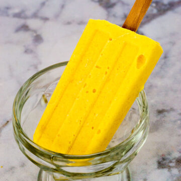 Mango creamsicles have only three ingredients, and are so easy to make! They're my son's favorite treat on a hot summer day. #SundaySupper