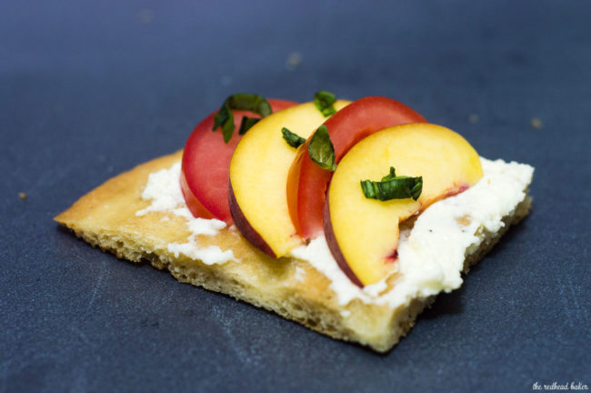 Tomato-peach flatbread is the perfect summer appetizer. You can't beat fresh summer tomatoes and peaches, plus no cooking required! #CLBlogger Recipe at TheRedheadBaker.com