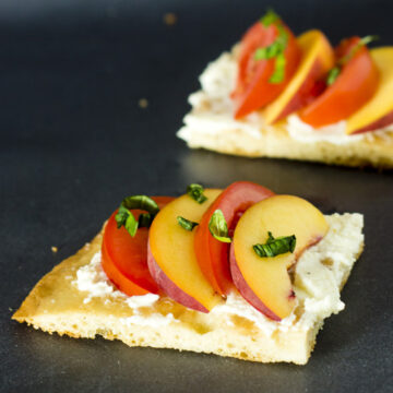 Tomato-peach flatbread is the perfect summer appetizer. You can't beat fresh summer tomatoes and peaches, plus no cooking required! #CLBlogger Recipe at TheRedheadBaker.com