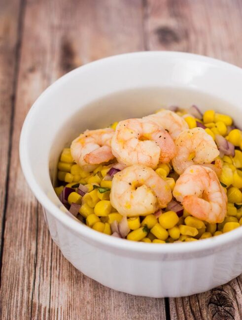 Can dinner be both easy AND healthy? Yes! Serve lemon shrimp over a salad of corn, red onion and basil with a red wine vinaigrette.