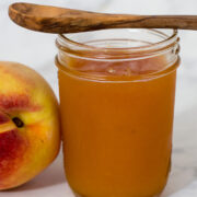 Peach butter is smoother and less sweet than peach preserves, resulting in a purer peach flavor. Canning peach butter preserves the flavor all year long. #SundaySupper