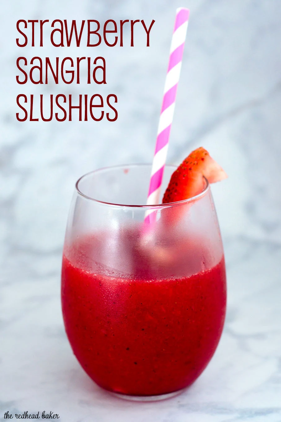 Strawberry sangria slushies are a fun frozen cocktail — white wine blends with frozen strawberries and triple sec for a delicious summer treat!