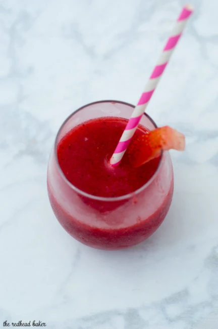 Strawberry sangria slushies are fun frozen cocktail &mdash; white wine blends with frozen strawberries and triple sec for a delicious summer treat!