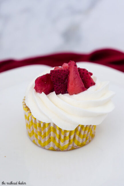 Strawberry shortcake cupcakes are an easy dessert that kids and adults alike will enjoy. Vanilla cupcakes are topped with whipped cream and strawberries.