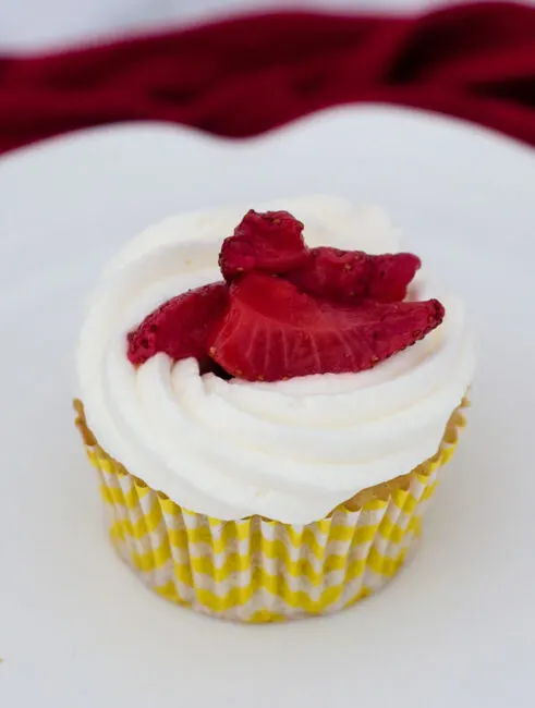 Strawberry shortcake cupcakes are an easy dessert that kids and adults alike will enjoy. Vanilla cupcakes are topped with whipped cream and strawberries.