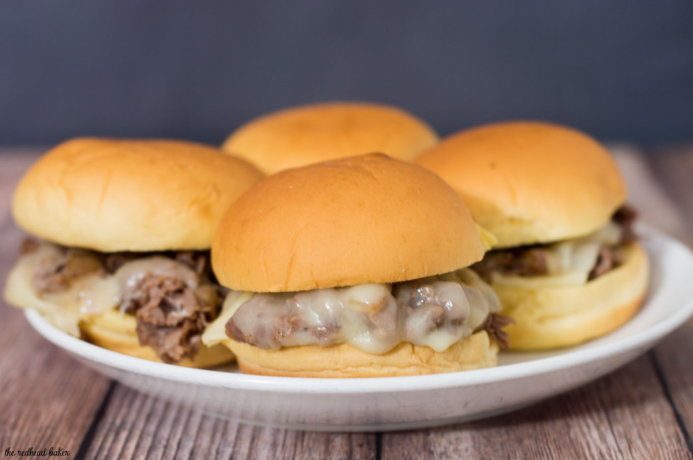 Snack on these easy Philly cheesesteak sliders, loaded with beef, fried onions, and provolone cheese at your next football party! #SundaySupper