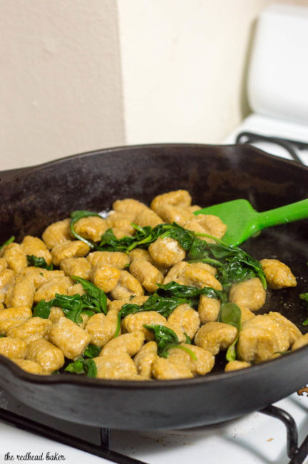 Pumpkin gnocchi and spinach with sage brown butter sauce is a hearty vegetarian meal full of flavor. You won't miss the meat! #SundaySupper