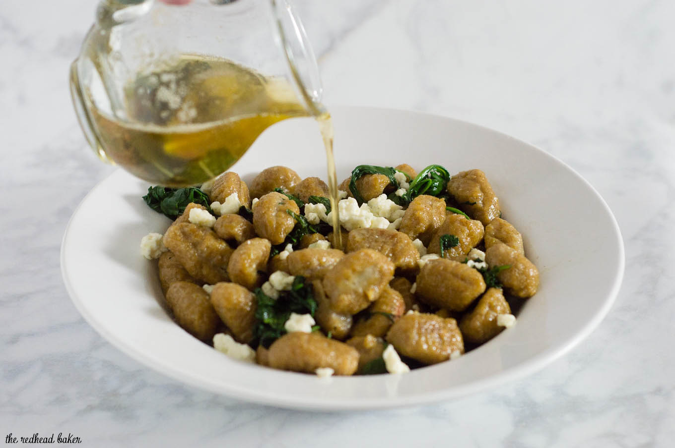 Pumpkin gnocchi and spinach with sage brown butter sauce is a hearty vegetarian meal full of flavor. You won't miss the meat! #SundaySupper