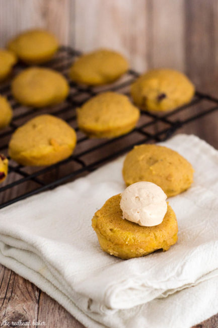 Two soft, light pumpkin cookies studded with fresh cranberries are sandwiched with creamy dulce de leche marshmallow filling.