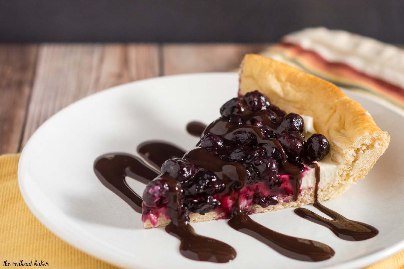 Pizza for dessert? You bet! Cheesecake Pizza has crescent dough as the crust, topped with sweetened cream cheese, berry compote and chocolate sauce. #SundaySupper