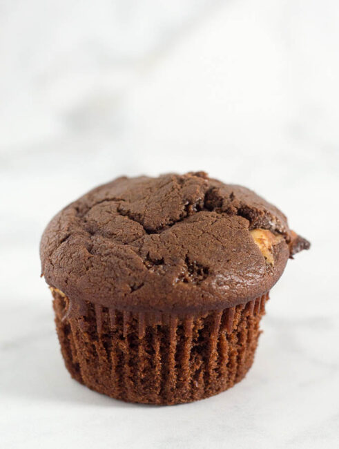 Double chocolate muffins pack a double punch -- rich semisweet chocolate in the muffin batter, and white chocolate chips mixed in. Are they for breakfast or dessert? You decide! #Choctoberfest