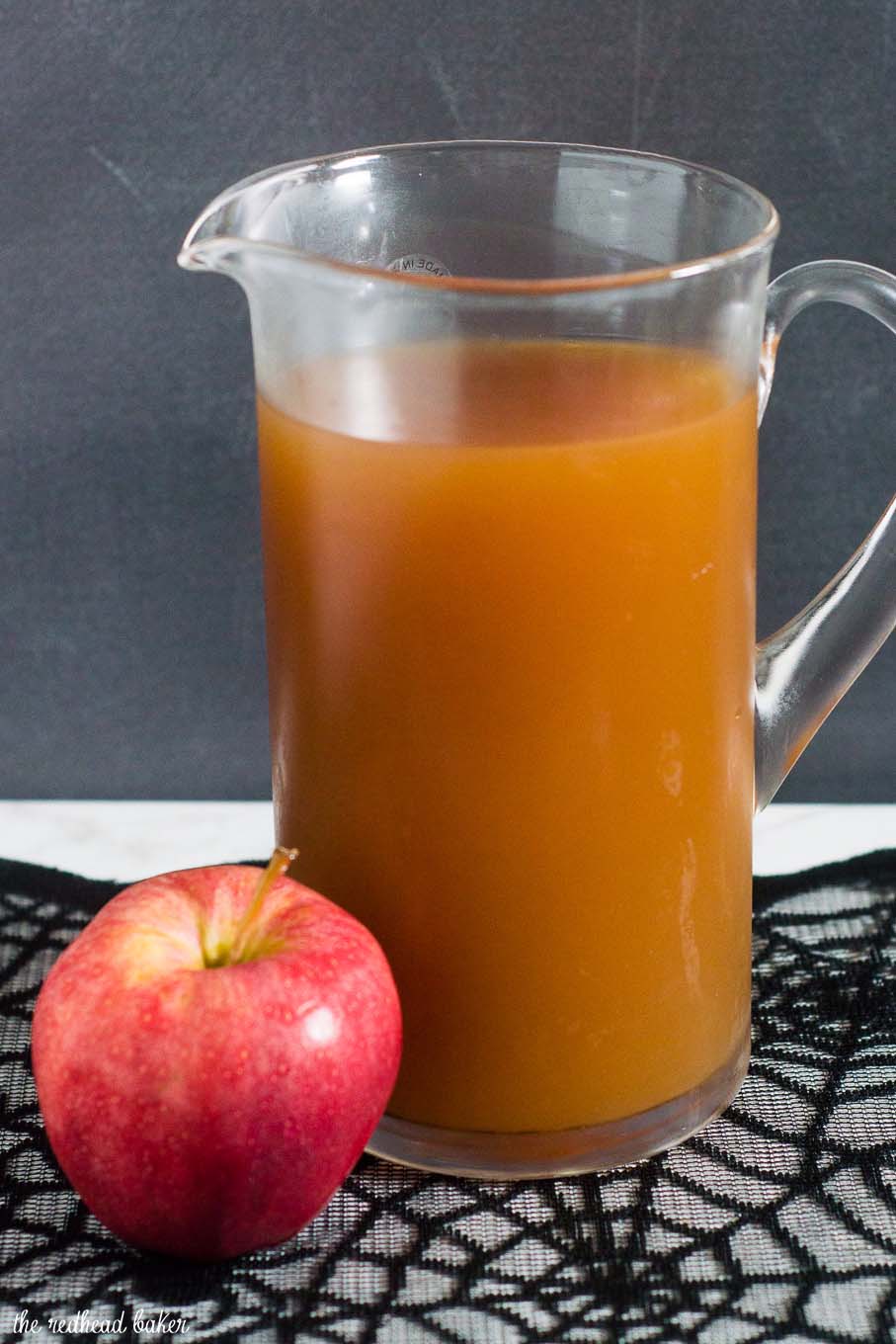 Serve a spooky witch's brew at your Halloween party — a Poison Apple Cider Cocktail, with rum and cinnamon-infused brandy! 