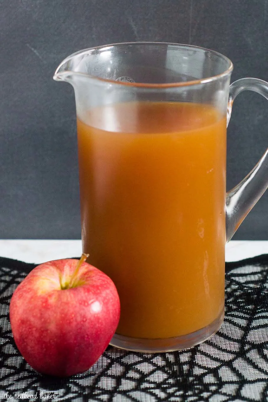 Serve a spooky witch's brew at your Halloween party — a Poison Apple Cider Cocktail, with rum and cinnamon-infused brandy! 