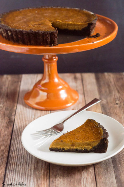 Move over, classic pumpkin pie! Pumpkin brulee tart has a custard-like spiced pumpkin filling baked in a chocolate cookie tart shell, then is sprinkled with sugar and bruleed. #PumpkinWeek