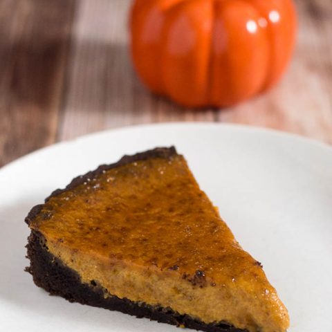 Move over, classic pumpkin pie! Pumpkin brulee tart has a custard-like spiced pumpkin filling baked in a chocolate cookie tart shell, then is sprinkled with sugar and bruleed. #PumpkinWeek