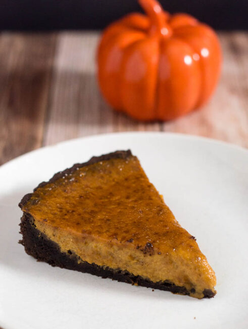 Move over, classic pumpkin pie! Pumpkin brulee tart has a custard-like spiced pumpkin filling baked in a chocolate cookie tart shell, then is sprinkled with sugar and bruleed. #PumpkinWeek