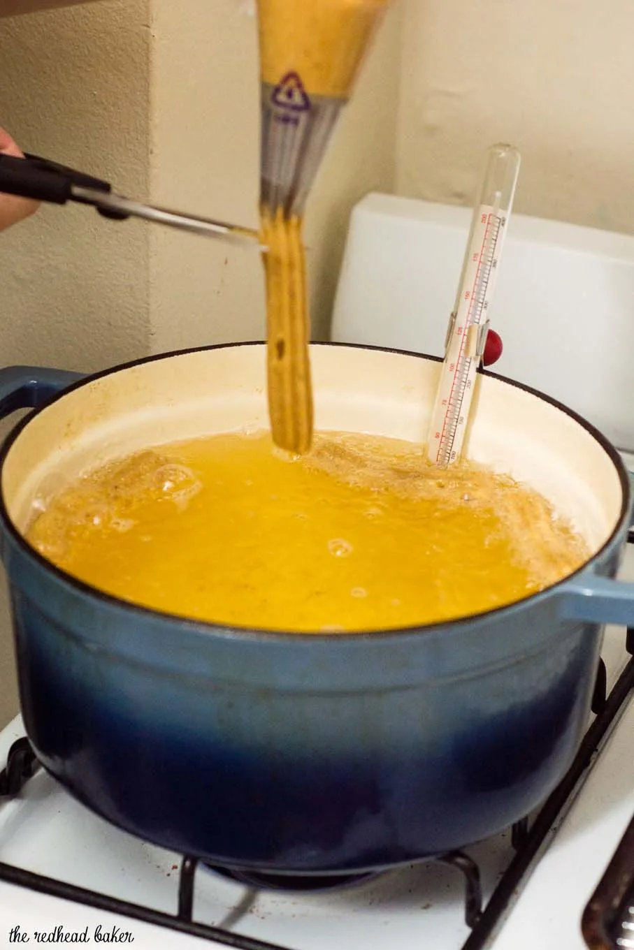 Pumpkin churros are a fall twist on a sweet treat. Sweet pumpkin dough is deep fried, rolled in pumpkin-spiced sugar and dipped in decadent dulce de leche. #PumpkinWeek