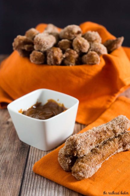 Pumpkin churros are a fall twist on a Mexican treat. Sweet pumpkin dough is deep fried, rolled in pumpkin-spiced sugar and dipped in decadent dulce de leche. #PumpkinWeek