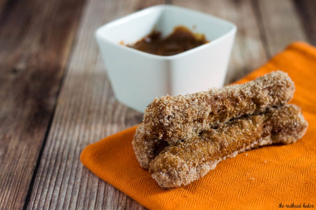 Pumpkin churros are a fall twist on a Mexican treat. Sweet pumpkin dough is deep fried, rolled in pumpkin-spiced sugar and dipped in decadent dulce de leche. #PumpkinWeek