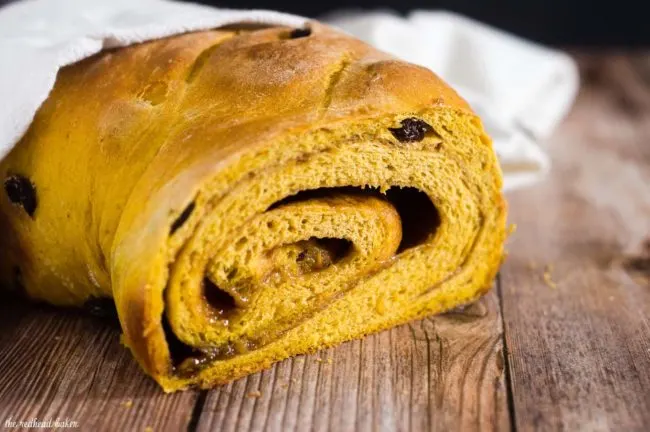 Comfort food with a fall twist &mdash; pumpkin cinnamon raisin bread is studded with raisins with a swirl of cinnamon, butter and brown sugar. #PumpkinWeek