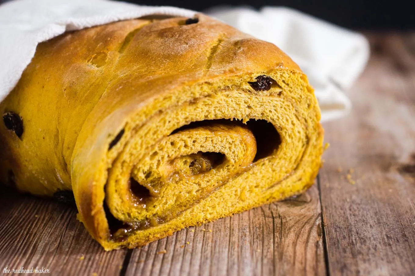 Comfort food with a fall twist — pumpkin cinnamon raisin bread is studded with raisins with a swirl of cinnamon, butter and brown sugar. #PumpkinWeek