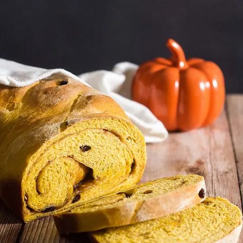 Comfort food with a fall twist — pumpkin cinnamon raisin bread is studded with raisins with a swirl of cinnamon, butter and brown sugar. #PumpkinWeek