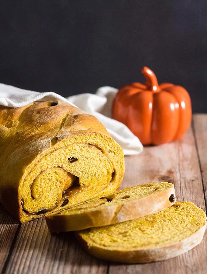 Comfort food with a fall twist — pumpkin cinnamon raisin bread is studded with raisins with a swirl of cinnamon, butter and brown sugar. #PumpkinWeek
