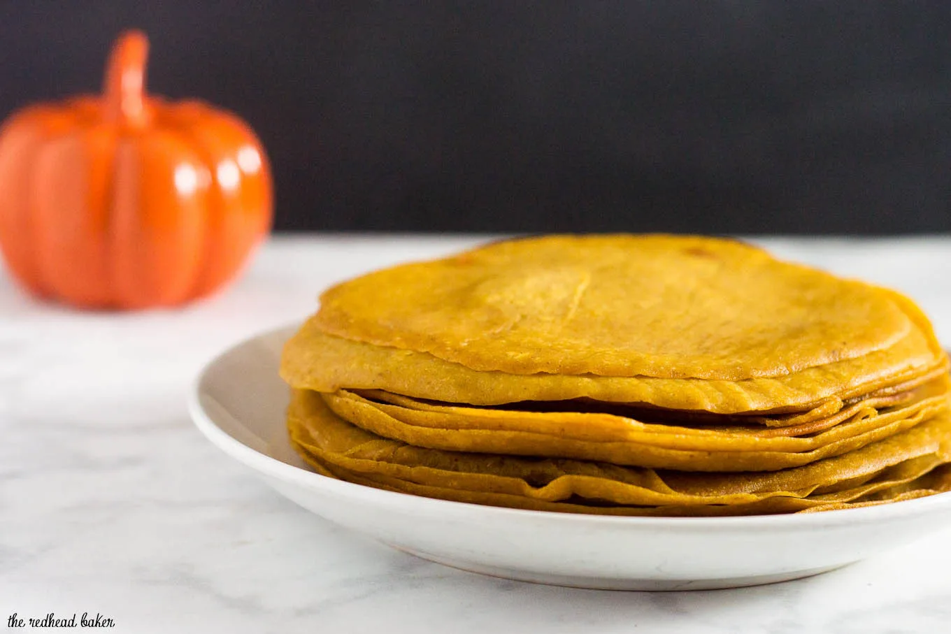 Pumpkin crepes are very thin dessert pancakes, folded over sweetened cream cheese filling and drizzled with dulce de leche. #PumpkinWeek